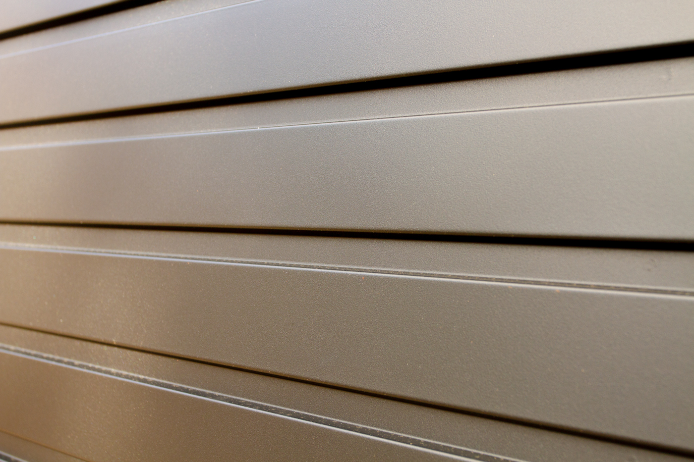 Garador Horizon + 4 point locking Horizontally Ribbed Retractable Garage Door in RAL9005 Black