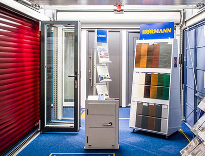 Access Garage Doors showroom displaying various garage door options and Hörmann products