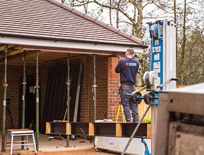 Access Garage Doors technician working on a garage door conversion project