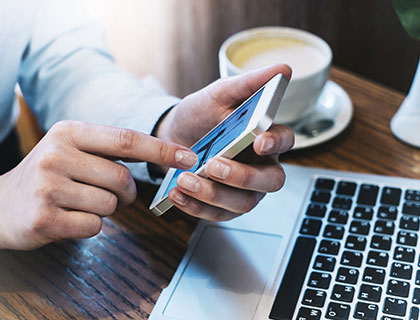 Customer ordering garage doors online via smartphone, provided by Access Garage Doors.