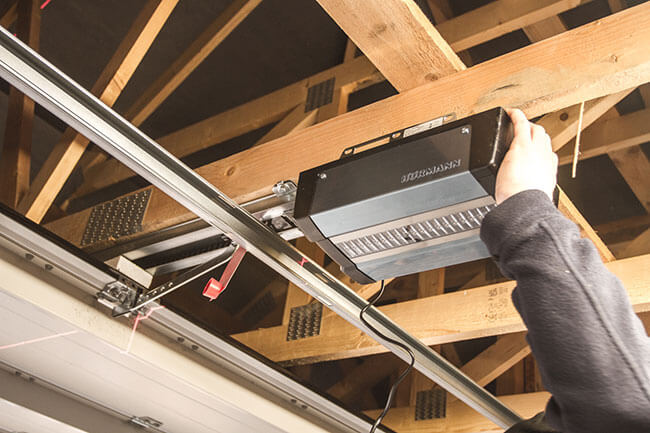 Access Garage Doors technician installing garage doors opener system
