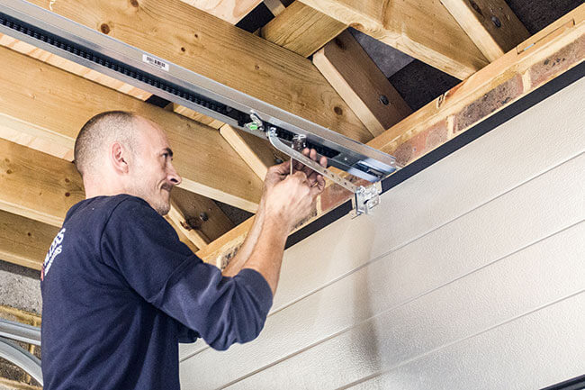 Access Garage Doors technician fitting garage doors track system