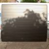 Garador Horizon + 4 point locking Horizontally Ribbed Retractable Garage Door in RAL9005 Black