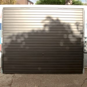 Garador Horizon + 4 point locking Horizontally Ribbed Retractable Garage Door in RAL9005 Black