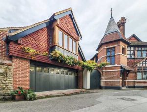 Ryterna SSD side sliding garage door finished in Farrow & Ball's Studio Green - period property