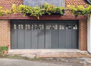 Ryterna SSD side sliding garage door finished in Farrow & Ball's Studio Green