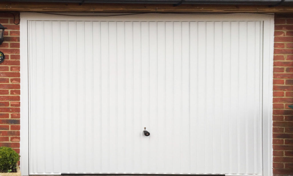 Hormann 2001 Vertical-Ribbed Retractable Garage Door in Traffic White
