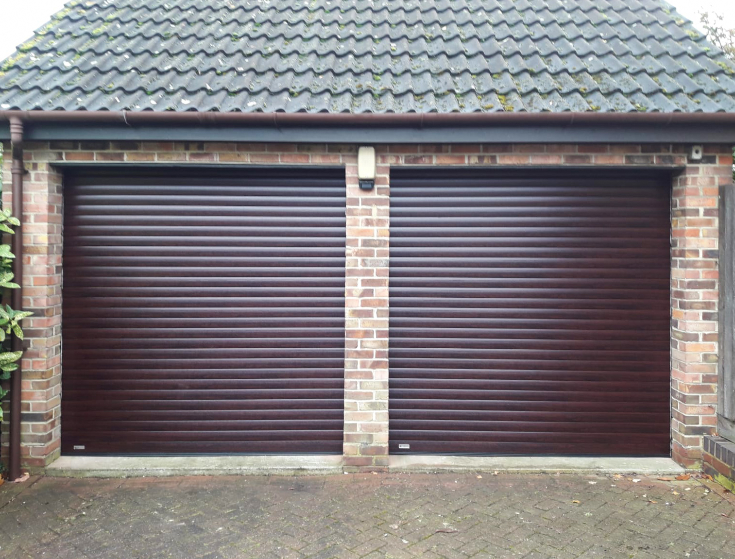 SWS SeceuroGlide Insulated Roller Garage Doors Finished in Woodgrain Rosewood