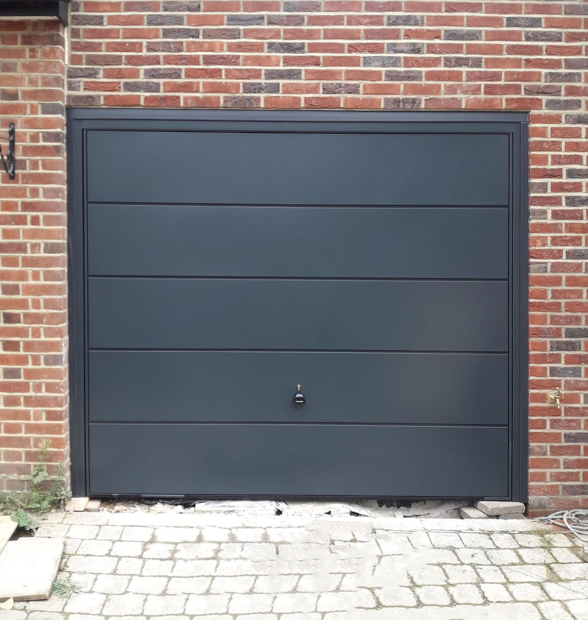 Garador ASCOT wide ribbed Steel Up & Over Garage Door Finished in Anthracite Grey.