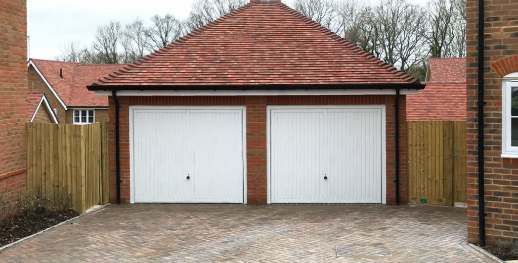 2 x Garador Sutton Retractable Garage Doors finished in Traffic White