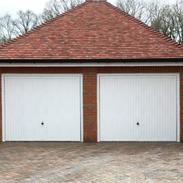 2 x Garador Sutton Retractable Garage Doors finished in Traffic White