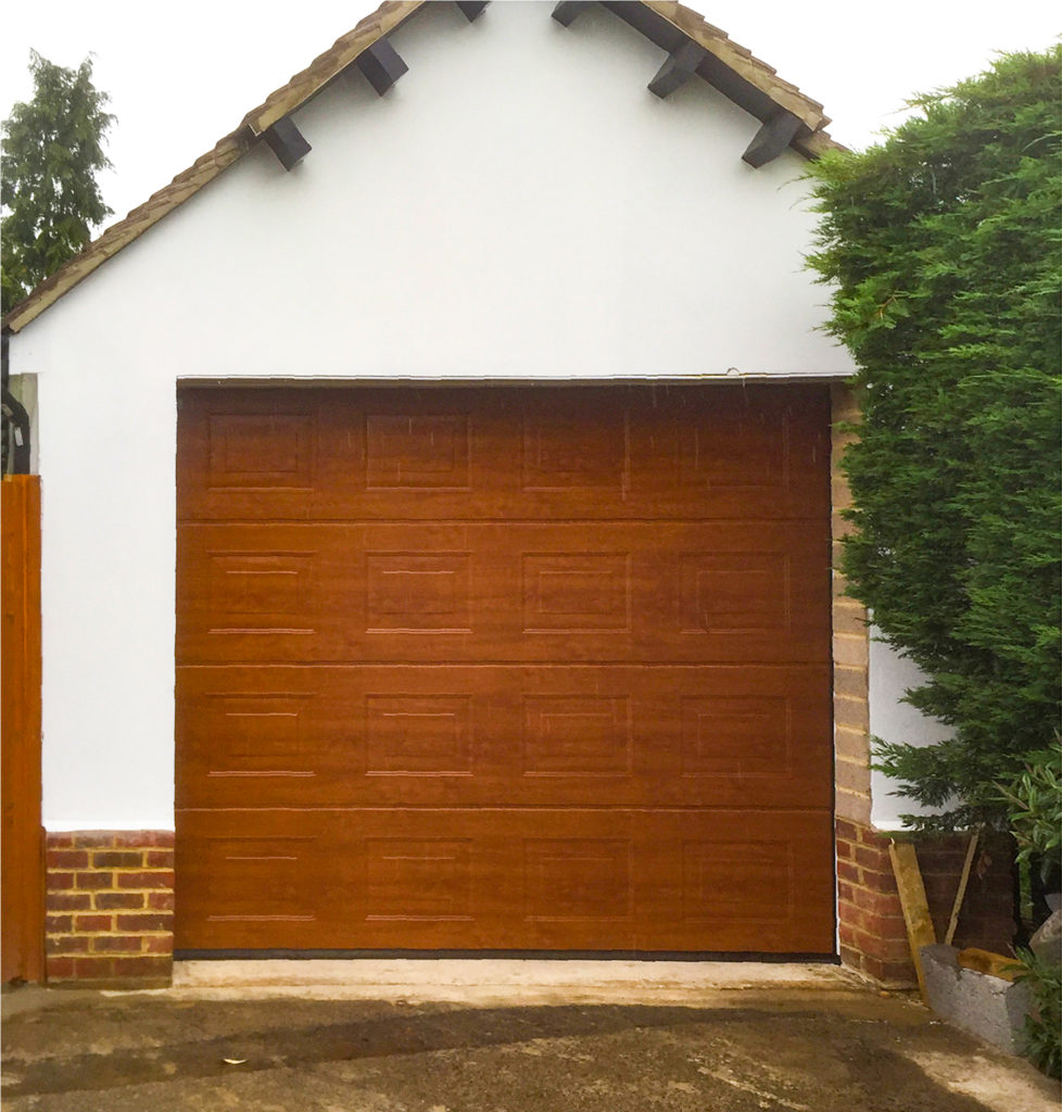 Hormann LPU 42 Panelled Insulated Sectional Garage Door Finished in Decograin Golden Oak
