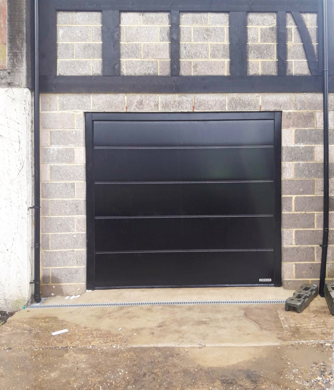 A Hormann Lpu42 L Ribbed Automated Sectional Garage Door Finished In Black