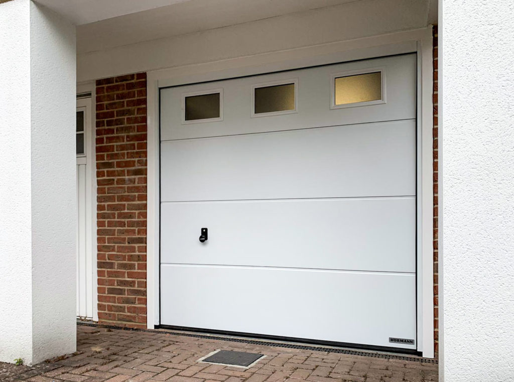 Hormann LPU42 L-Ribbed Insulated Sectional Garage Door With Windows finished in White