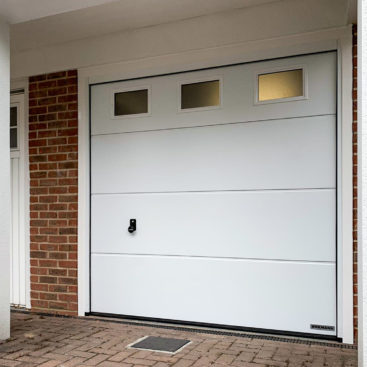 Hormann LPU42 L-Ribbed Insulated Sectional Garage Door With Windows finished in White