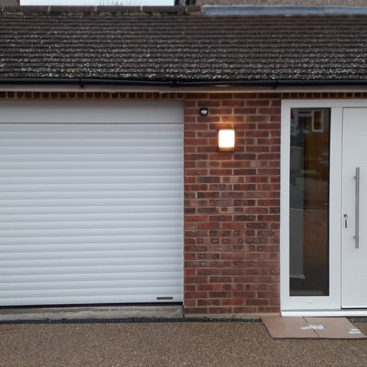 Hormann RollMatic Roller Garage Door & Ryterna RD80 Entrance Door Finished in White