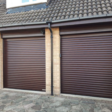 Hormann Rollmatic Fully Automated Roller Garage Door Finished in Rosewood Decograin