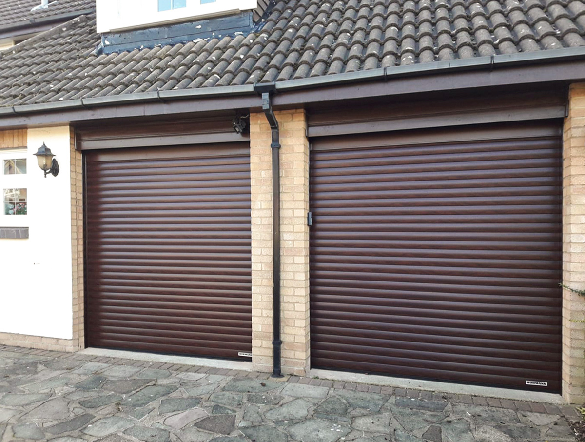 Hormann Rollmatic Fully Automated Roller Garage Door Finished in Rosewood Decograin