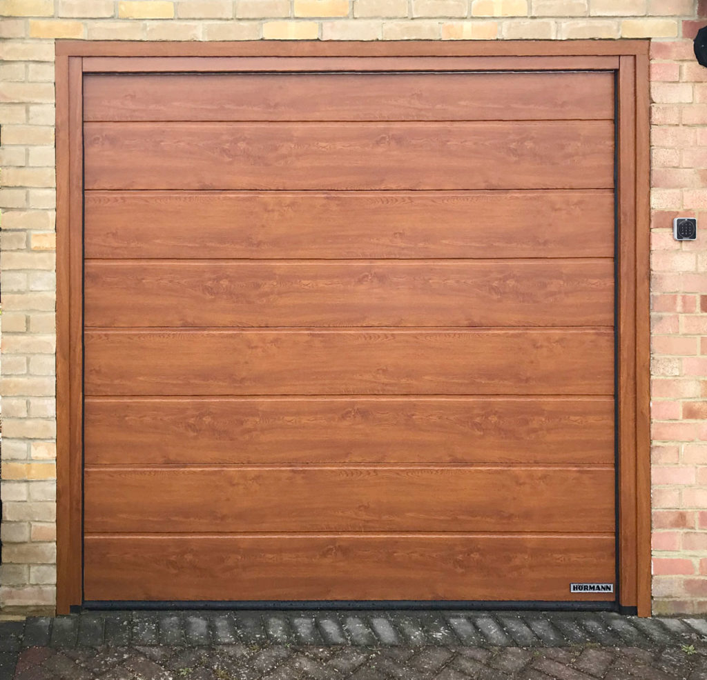 Hormann LPU42 Garage Door in a Golden Oak Decograin
