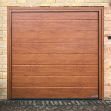 Hormann LPU42 Garage Door in a Golden Oak Decograin