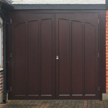 A Woodrite Twickenham Side Hinged Garage Door finished in Mahogany