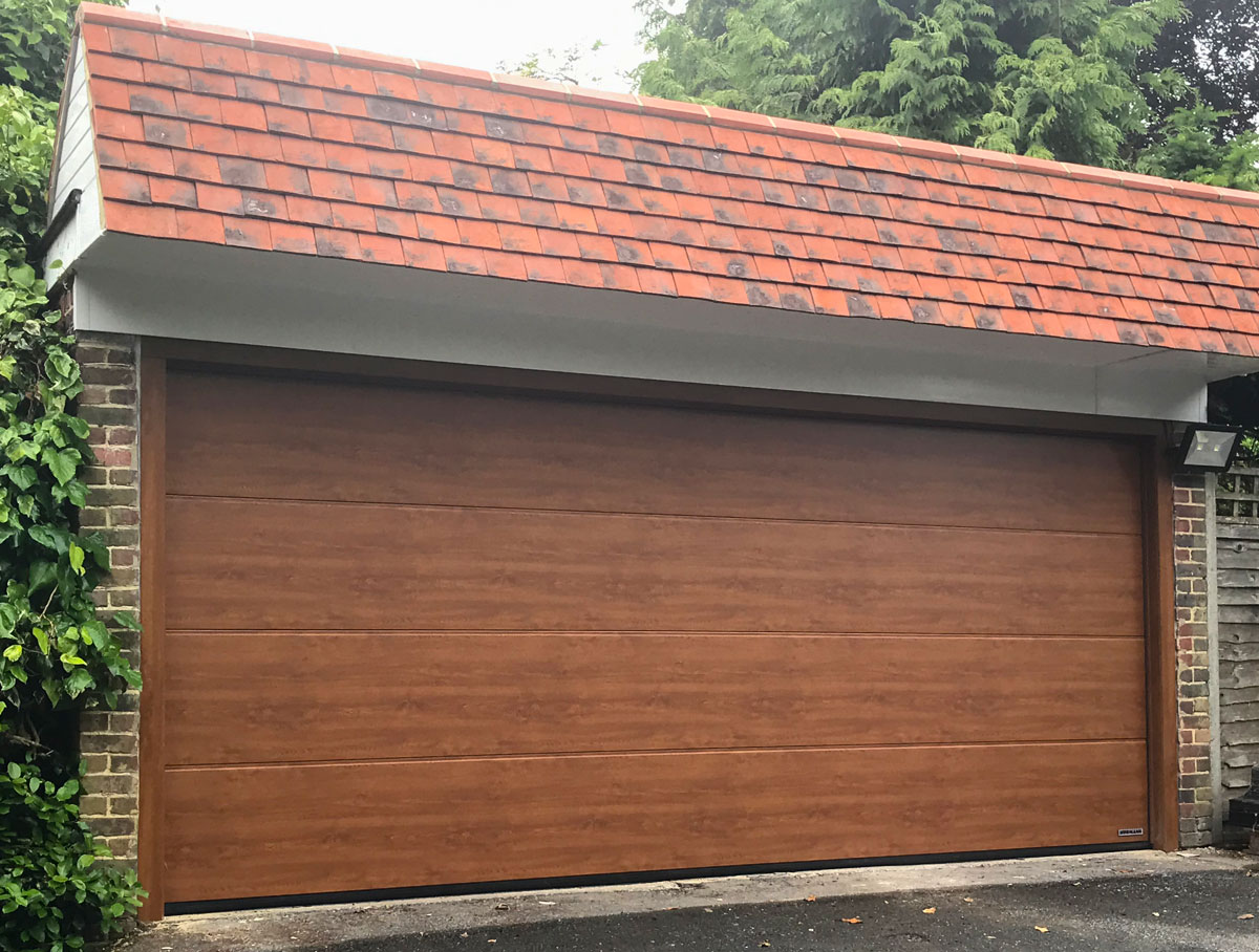 Hormann LPU42 L Ribbed Garage Door in Golden Oak