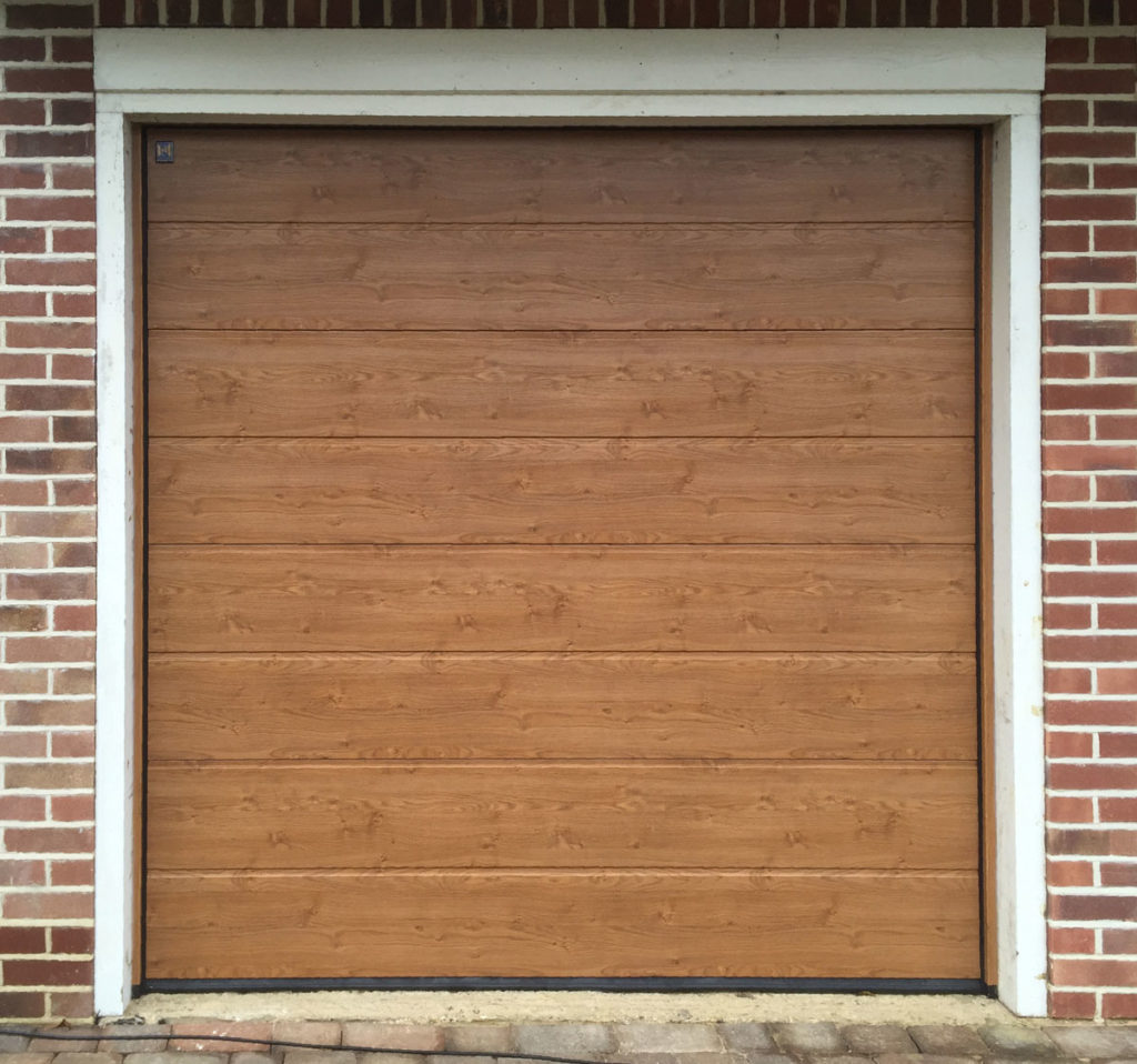 Hormann LPU42, M-Ribbed, Sectional Garage Door in Golden Oak Decograin