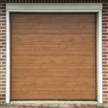 Hormann LPU42, M-Ribbed, Sectional Garage Door in Golden Oak Decograin
