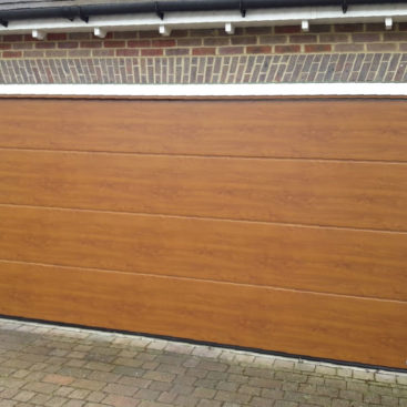 Hormann LPU42 Garage Door in Golden Oak