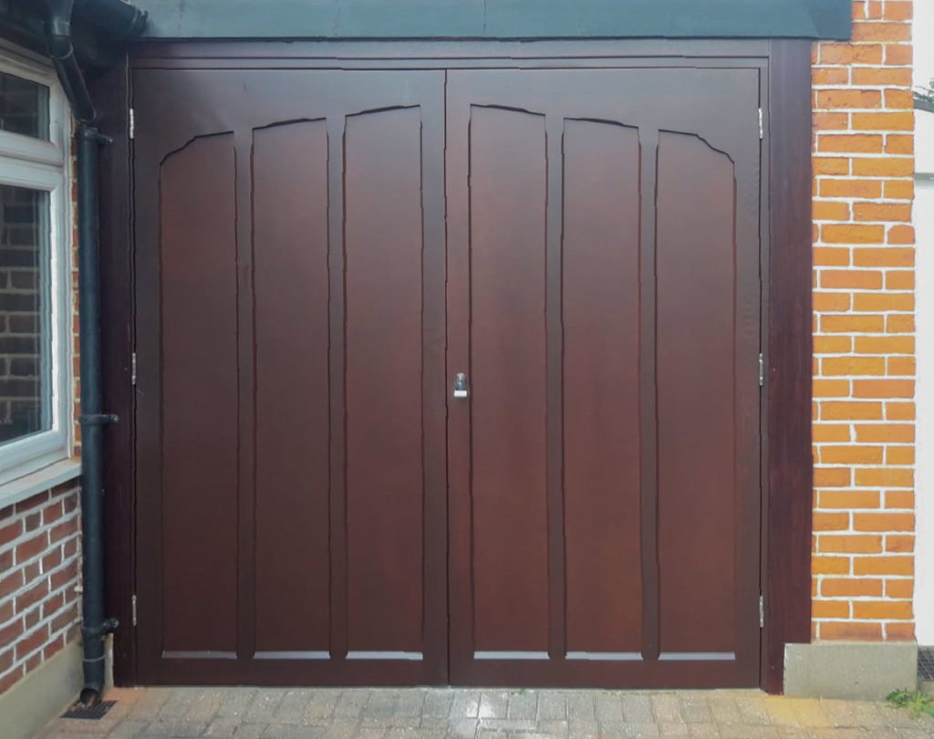 A pair of Woodrite Side-Hinged Garage Doors