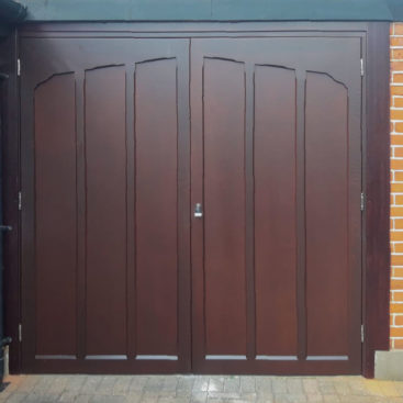 A pair of Woodrite Side-Hinged Garage Doors