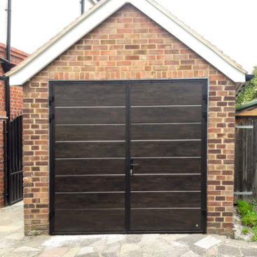 Ryterna Wide Horizontal Ribbed 50:50 Split Side Hinged Garage Doors Finished in Dark Oak Wood Effect