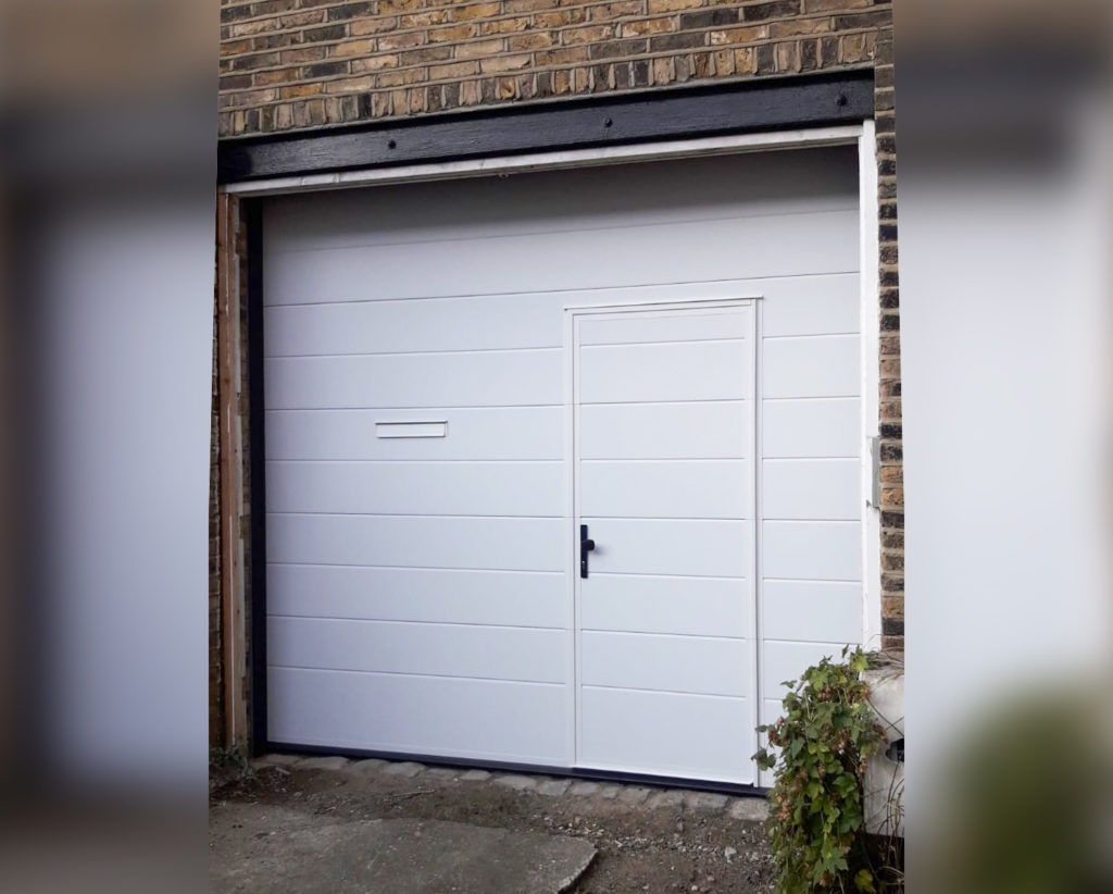 Ryterna Automated Sectional Garage Door with Wicket Door Finished in White