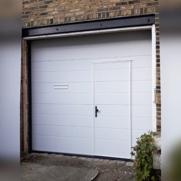 Ryterna Automated Sectional Garage Door with Wicket Door Finished in White