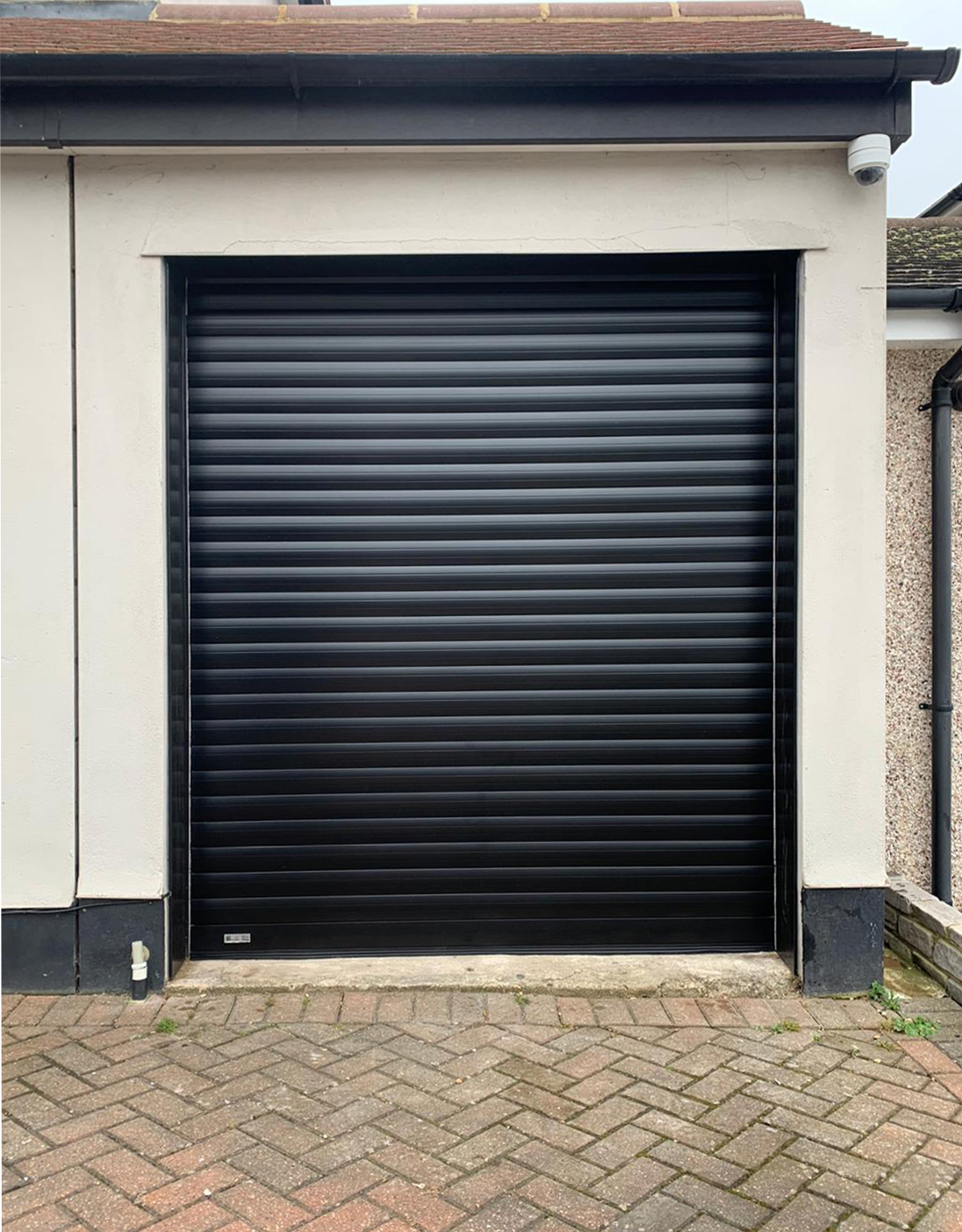 SWS SeceuroGlide Insulated Roller Garage Door Finished in Black & Installed in Stoneleigh