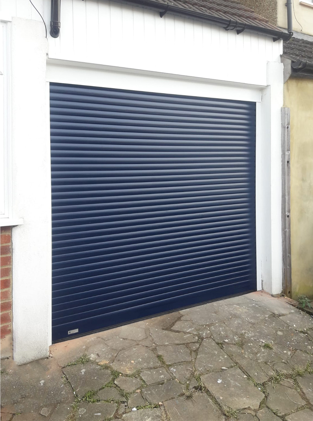 SeceuroGlide Fully Automated Compact Insulated Roller Garage Door finished In Navy Blue