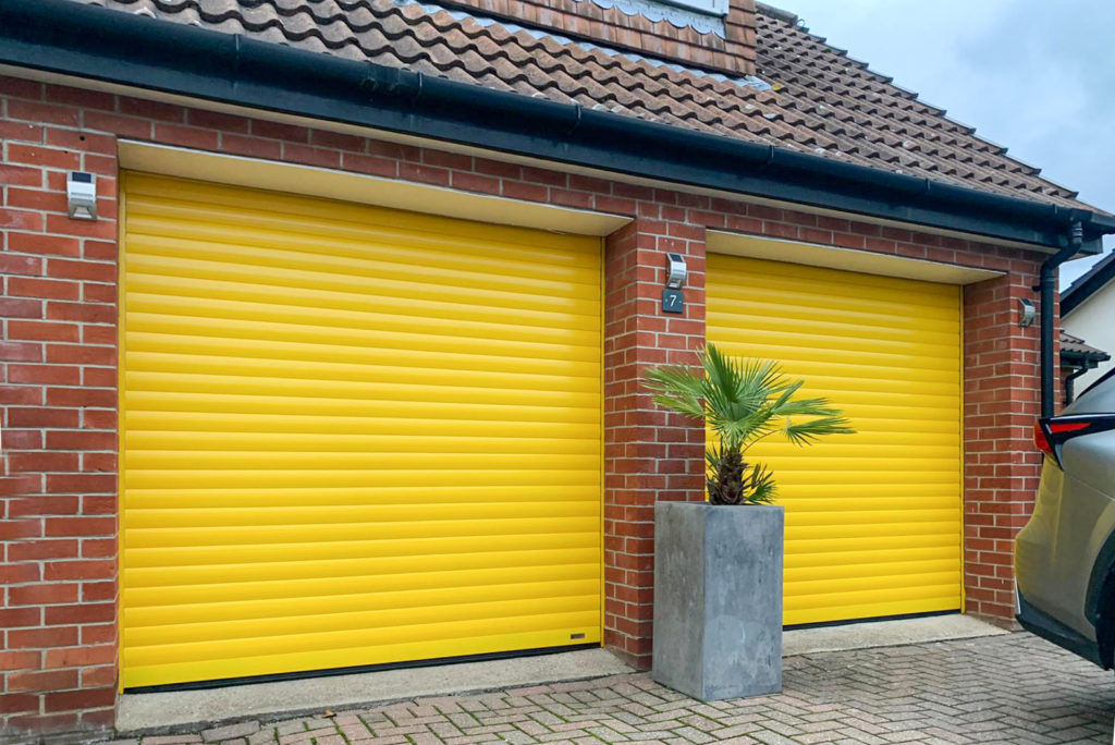 SWS SeceuroGlide Insulated Roller Garage Doors Finished in Traffic Yellow
