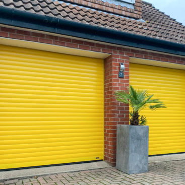 SWS SeceuroGlide Insulated Roller Garage Doors Finished in Traffic Yellow