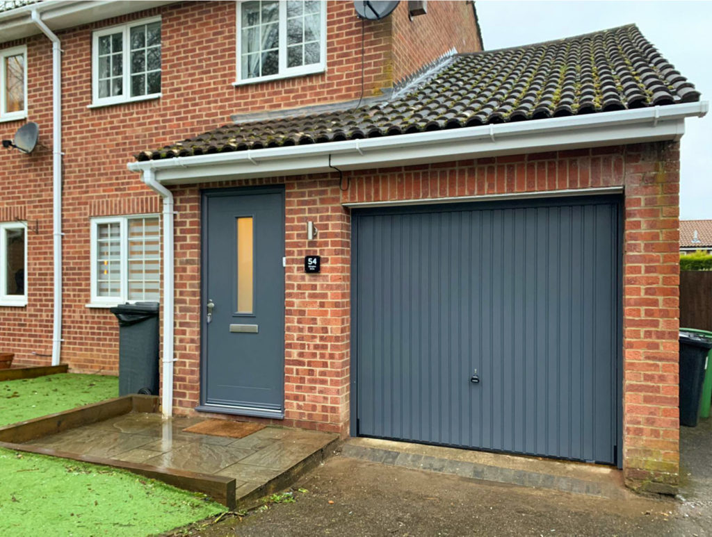 Hormann 2001 Canopy Steel Up & Over Garage Door & Truedor TR1W Entrance Door Finished in Slate Grey