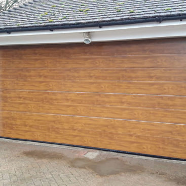 SeceuroGlide Elite Steel Sectional Garage Door in Golden Oak