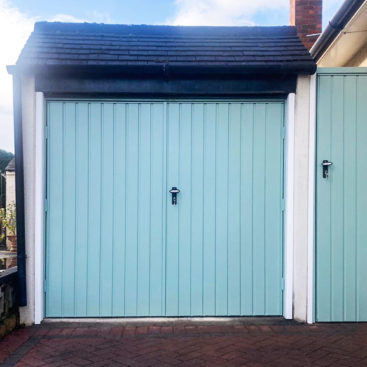 Fort Doors Vertical Small Rib Steel Side Hinged Garage Doors with Matching Side Door Finished in Chartwell Green