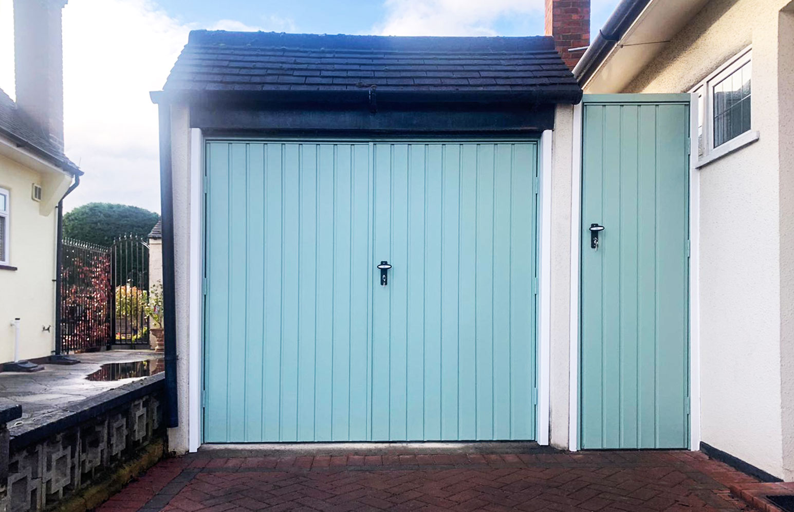 Fort Doors Vertical Small Rib Steel Side Hinged Garage Doors with Matching Side Door Finished in Chartwell Green