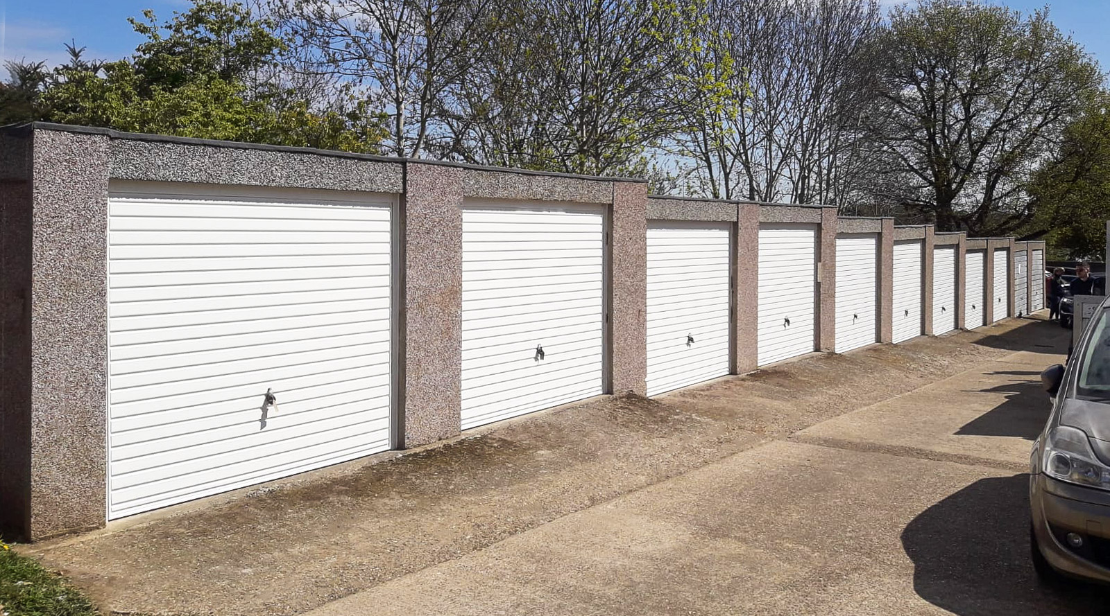 A row of 9 Hormann 2002 Horizontal Up and Over Garage Doors