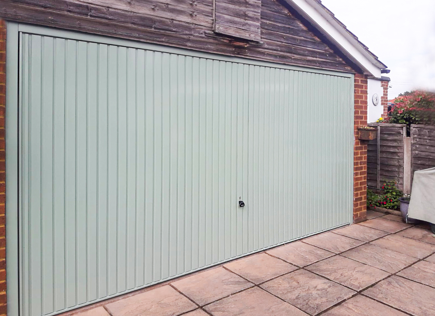 Garador Carlton Steel Retractable Double Up-and-Over Garage Door in Chartwell Green