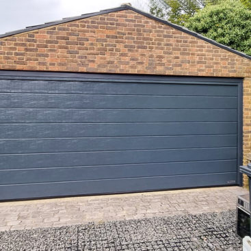 Hormann LPU42 Sectional garage door in Anthracite Woodgrain