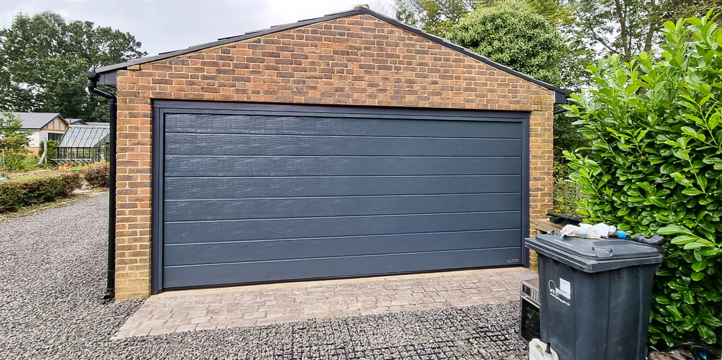 Hormann LPU42 Sectional garage door in Anthracite Woodgrain