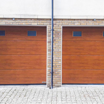 Hormann LPU42 L-Ribbed Insulated Sectional Garage Doors with Windows in Golden Oak Decograin