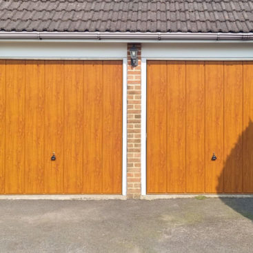 Garador Sherwood Steel Timber Effect Up & Over Canopy Garage Doors in Golden Oak