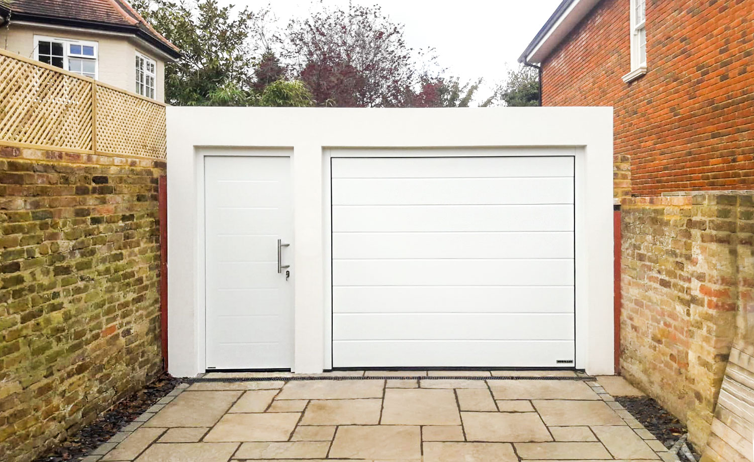 Hormann LPU42 M-Ribbed Sectional Garage door and Thermo 65 Front Door in White