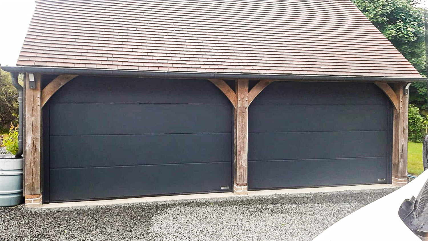 Hormann LPU42 L-Ribbed Insulated Steel Sectional Garage Doors in Anthracite Sandgrain